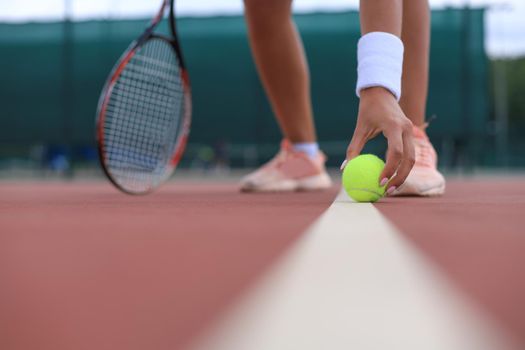 Tennis racket and the ball on tennis court