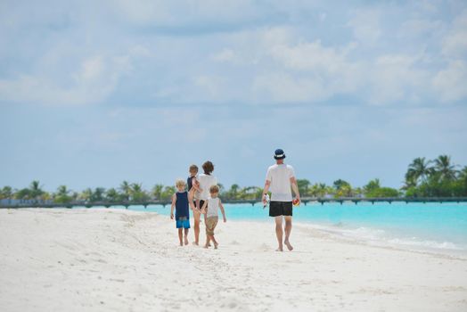 Portrait of a happy family on summer vacation  at beach