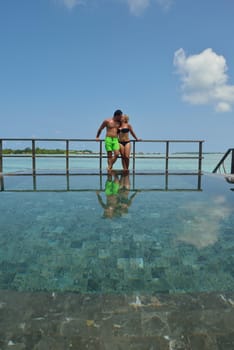 happy young  couple at summer vacation have fun and relax at beautiful sunny  day on beach