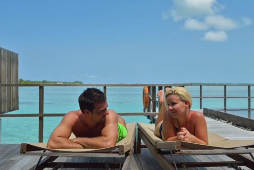 happy young  couple at summer vacation have fun and relax at beautiful sunny  day on beach