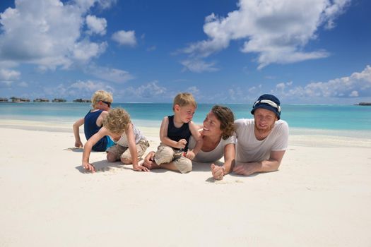 Portrait of a happy family on summer vacation  at beach