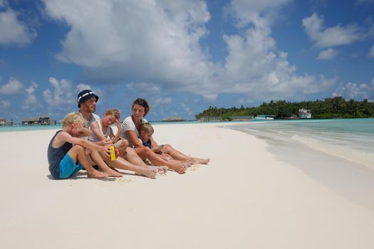 Portrait of a happy family on summer vacation  at beach