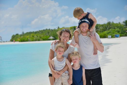 Portrait of a happy family on summer vacation  at beach