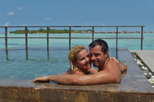 happy young  couple at summer vacation have fun and relax at beautiful sunny  day on beach