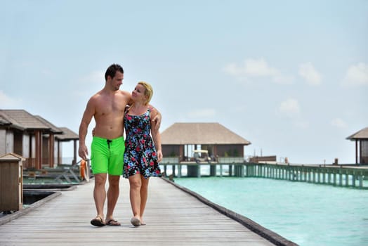 happy young  couple at summer vacation have fun and relax at beautiful sunny  day on beach