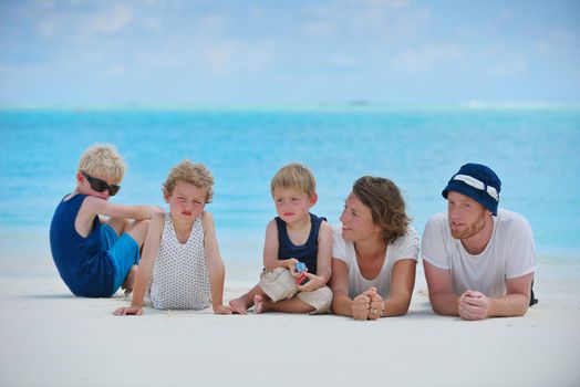 Portrait of a happy family on summer vacation  at beach