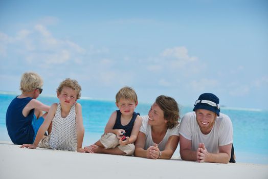 Portrait of a happy family on summer vacation  at beach