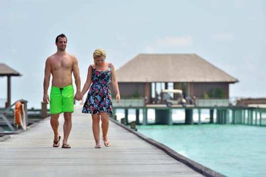 happy young  couple at summer vacation have fun and relax at beautiful sunny  day on beach