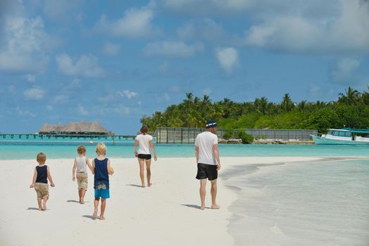 Portrait of a happy family on summer vacation  at beach