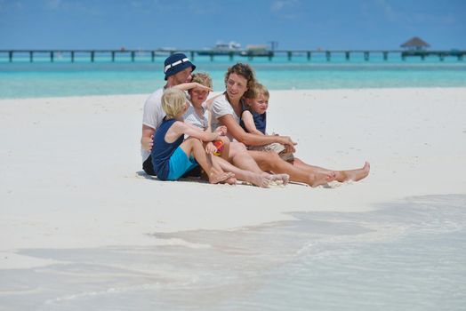 Portrait of a happy family on summer vacation  at beach