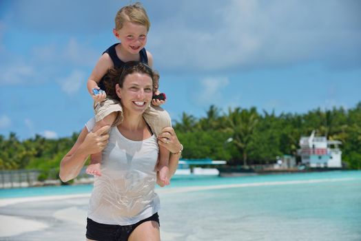 Portrait of a happy family on summer vacation  at beach