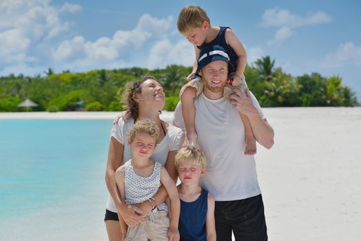 Portrait of a happy family on summer vacation  at beach