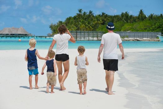 Portrait of a happy family on summer vacation  at beach