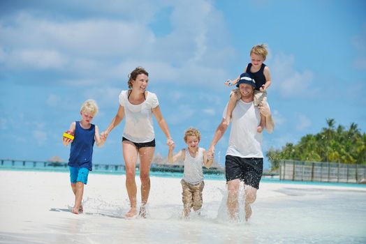 Portrait of a happy family on summer vacation  at beach