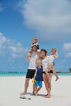 Portrait of a happy family on summer vacation  at beach