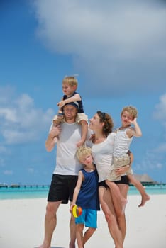 Portrait of a happy family on summer vacation  at beach