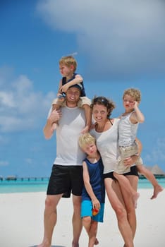 Portrait of a happy family on summer vacation  at beach