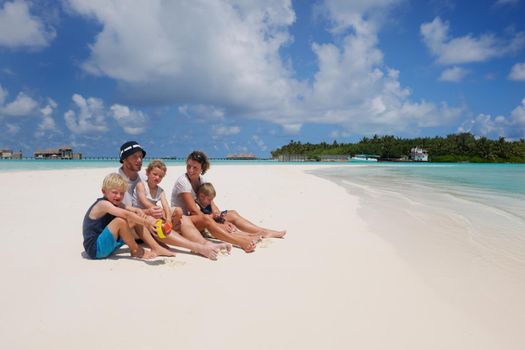 Portrait of a happy family on summer vacation  at beach