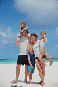 Portrait of a happy family on summer vacation  at beach