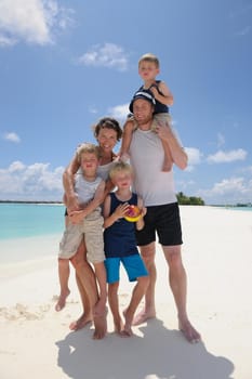 Portrait of a happy family on summer vacation  at beach