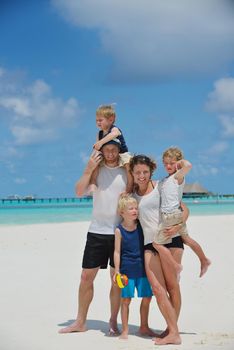 Portrait of a happy family on summer vacation  at beach