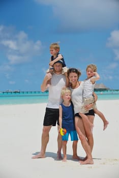 Portrait of a happy family on summer vacation  at beach