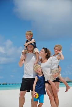 Portrait of a happy family on summer vacation  at beach