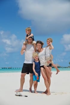 Portrait of a happy family on summer vacation  at beach