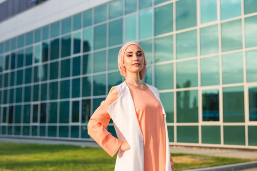 girl in abaya on the background of the business center.