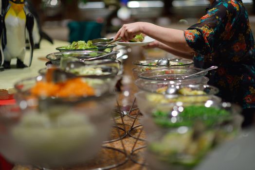 catering buffet food indoor in luxury restaurant with meat colorful fruits  and vegetables