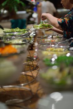 catering buffet food indoor in luxury restaurant with meat colorful fruits  and vegetables