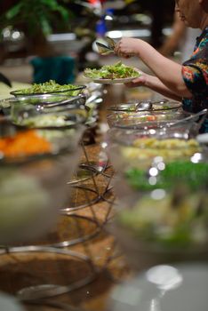 catering buffet food indoor in luxury restaurant with meat colorful fruits  and vegetables