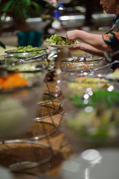 catering buffet food indoor in luxury restaurant with meat colorful fruits  and vegetables