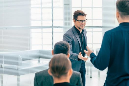 speaker answering a question during a working meeting . photo with a copy-space