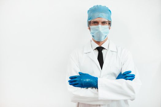 close up. serious doctor in a protective mask looking at you. the concept of health protection.