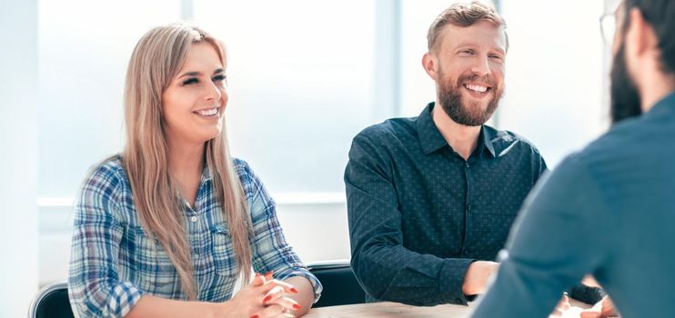 managers interview the applicant sitting at the office table. the concept of employment