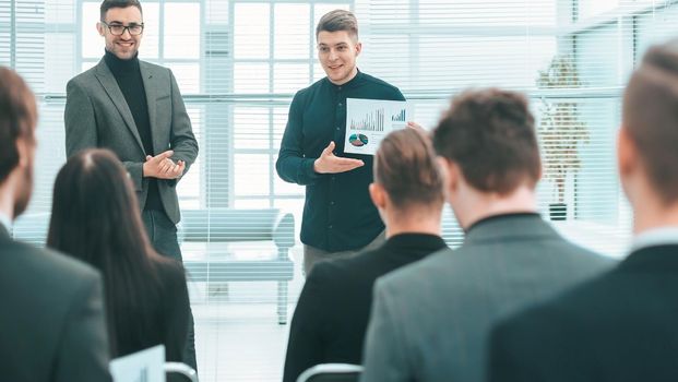 project Manager introducing a new employee .photo with a copy of the space