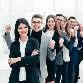 happy group of diverse young people standing in a row . the concept of teamwork