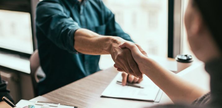 close up. handshake of business people in the office. concept of cooperation.