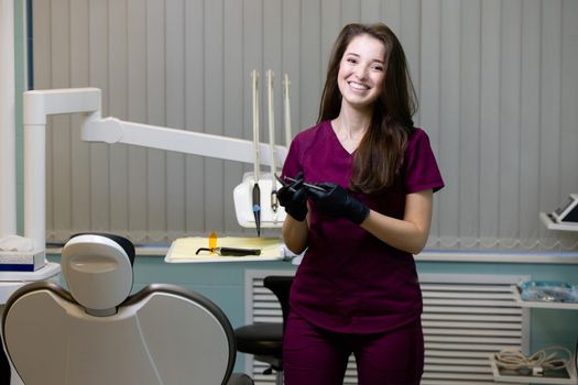 beautiful woman doctor with dental equipment in dentistry. High quality photo