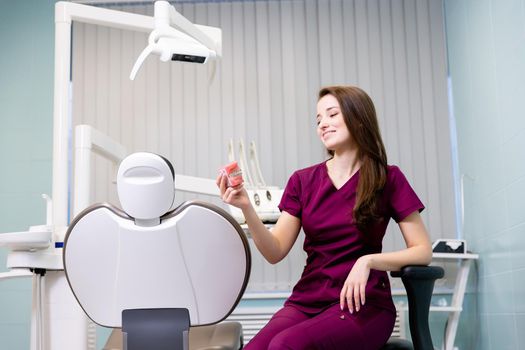 beautiful woman doctor with dental equipment in dentistry. High quality photo