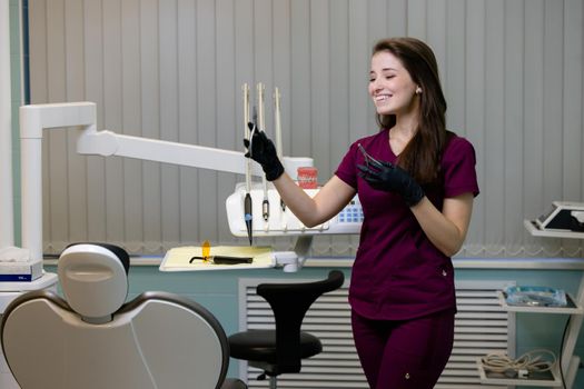 beautiful woman doctor with dental equipment in dentistry. High quality photo