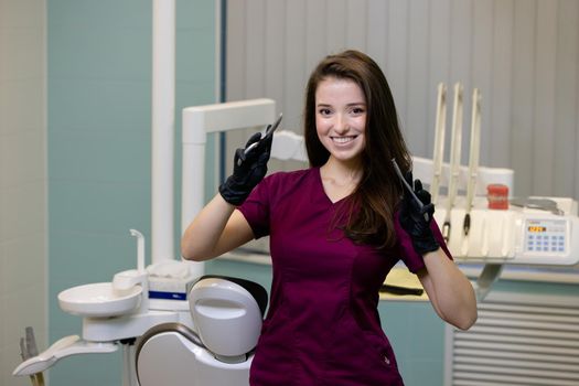 beautiful woman doctor with dental equipment in dentistry. High quality photo