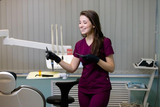 beautiful woman doctor with dental equipment in dentistry. High quality photo