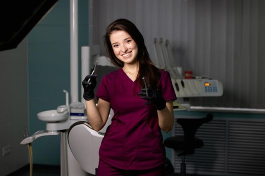 beautiful woman doctor with dental equipment in dentistry. High quality photo