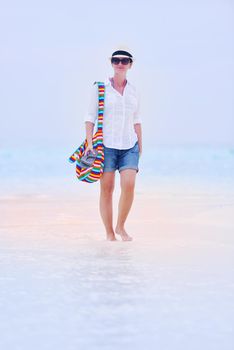 beautifel and happy woman girl on beach have fun and relax on summer vacation  over the beautiful tropical sea