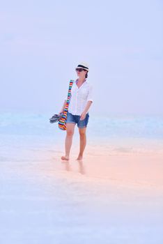 beautifel and happy woman girl on beach have fun and relax on summer vacation  over the beautiful tropical sea