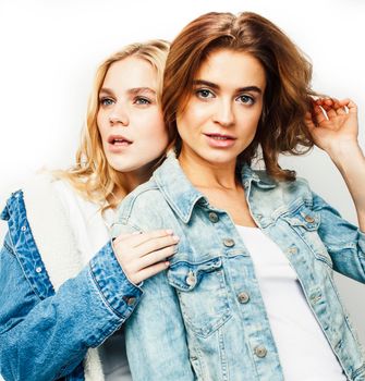 best friends teenage girls together having fun, posing emotional on white background, besties happy smiling, lifestyle people concept close up.