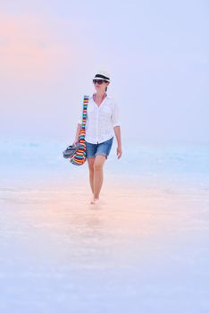 beautifel and happy woman girl on beach have fun and relax on summer vacation  over the beautiful tropical sea