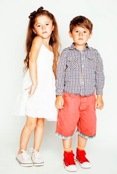 little cute boy and girl hugging playing on white background, happy family smiling close up